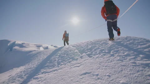 Hiking through the pristine snow on a glacier expedition Stock Footage 288174205
