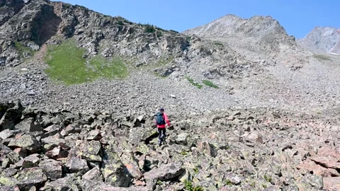 Hiking through a vast boulder field in the Rocky Mountains Stock Footage 158903130