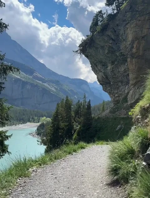 Hiking Trail Along Cliffside Overlooking Mountain Lake Stock Footage 340870173