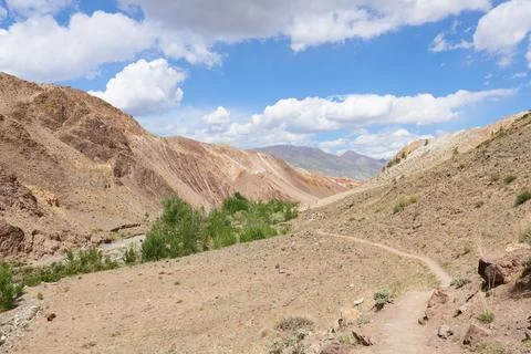 A hiking trail in the Altai Mountains in variable weather. 스톡 사진