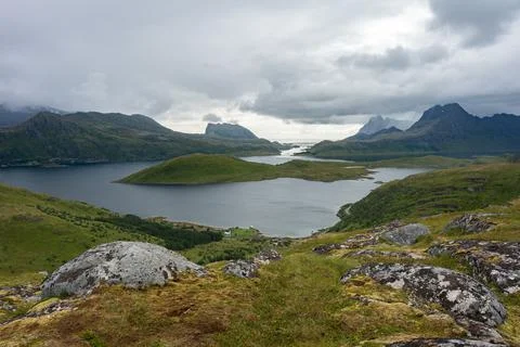 Hiking trail path through lakes valley cloudy view from Ryten mountain Stock Photos