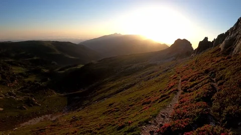 Hiking on a trail at sunrise Stock Footage 141361173