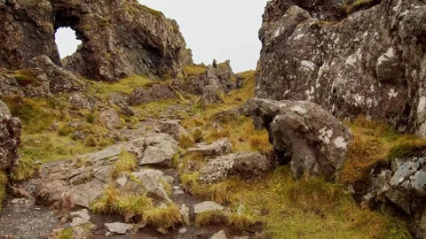 Hiking trail through a rocky, moss covered landscape in Iceland Video stock 320229521