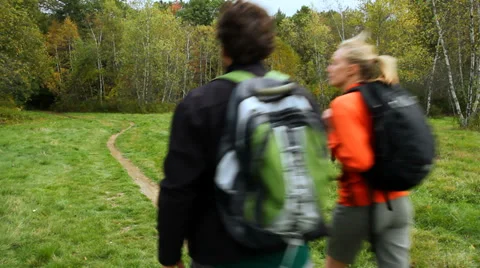 Hiking on a trail into the woods on a fall day. Stock Footage 31825199