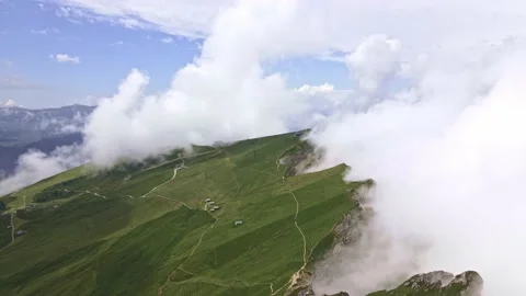 Hiking trails in Dolomites, Seceda on the edge of rocks covered in clouds Stock Footage 224544376