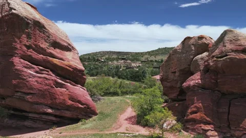Hiking trails through Red Rocks Ken Caryl Valley Ranch neighborhood homes North Stock Footage 339080094