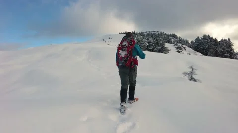Hiking in winter to the summit Stock Footage 166717233