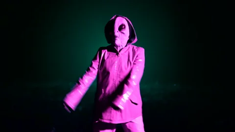 Hilarious alien dancing on dark backdrop. Funny meme footage of arrived on Stock-Footage 199669748