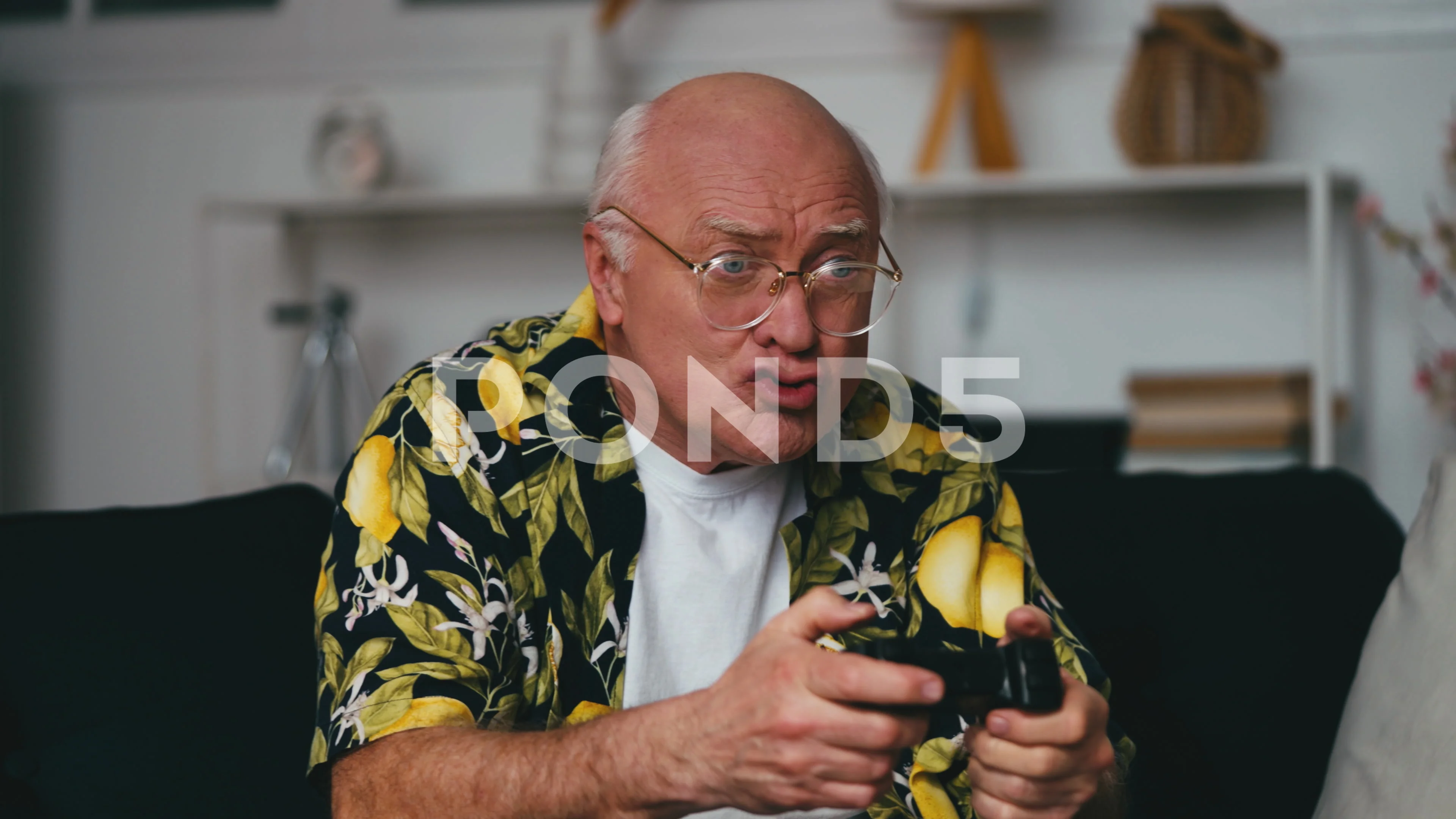 Hilarious grandpa playing video game using joystick, hanging out at home,  humor