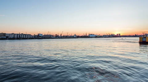 Hilharmonic building and harbor with container ships in the evening timelapse Video stock 50558541