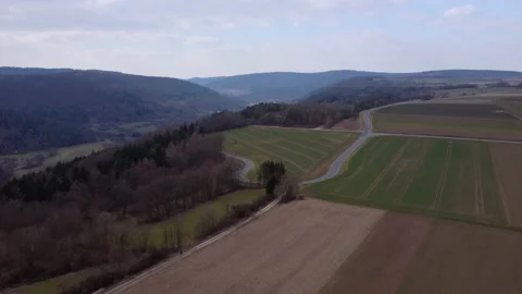 Hill and fields with forest in germany 動画素材 174278277