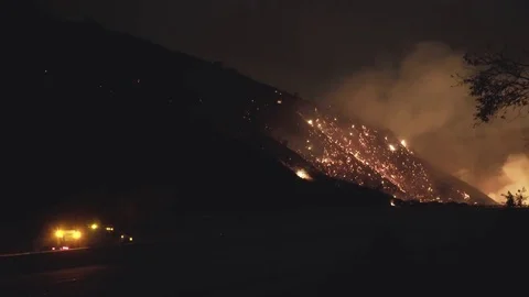 Hill Burning Next to Highway Stock-Footage 79933138