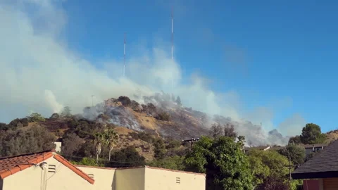 Hill Fire near communications tower - 4KUHD Stock Footage 344516824