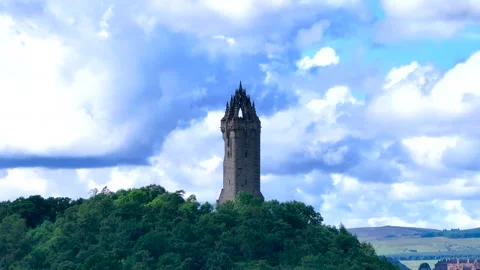 A hill with a large tower on top of it, Clear blue skies Stock Footage 306625766