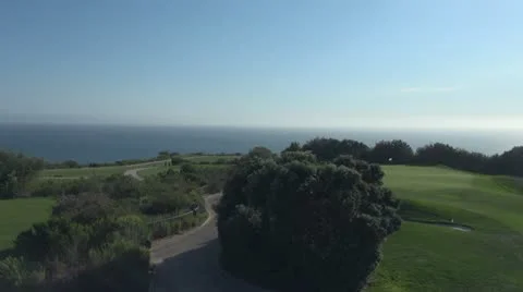 Hill with path in front of ocean Stock Footage 12118466