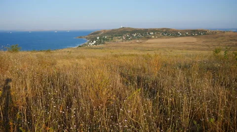 On the Hill Stands a Lighthouse. in the Distance You Can See the Sea Stock Footage 67812280