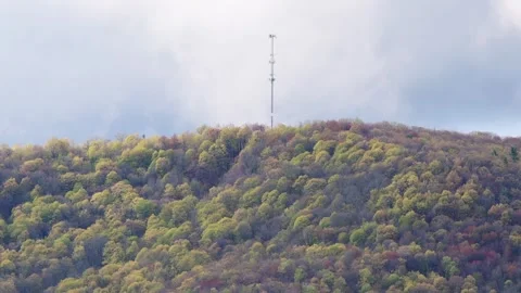 Hill top antena during spring weather overcast sky Stock Footage 259434285