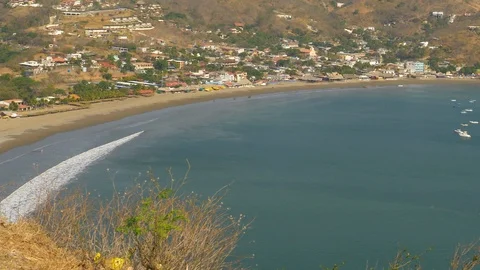Hill top view down on boats anchored San Juan del Sur harbor-Nicaragua-Pan Video stock 107717490