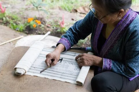 Hill tribe working on pattern of traditional clothes show for tourist Stock Photos