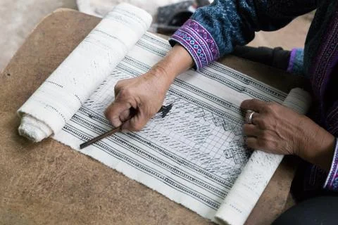 Hill tribe working on pattern of traditional clothes show for tourist Stock Photos