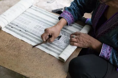 Hill tribe working on pattern of traditional clothes show for tourist Stock Photos