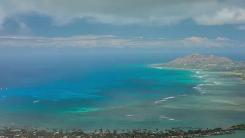 Up-hill view time lapse panoramic view of town near the sea on a sunny day Video stock 140350543