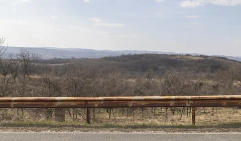 Hills and fields seen from the side of the road Stock Photos