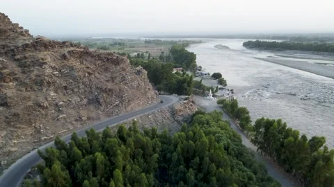 Hills, Greenery, Bumpy Roads, and the River's Embrace Video stock 274475246