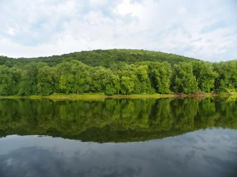 Hills Reflecting on River Stock Photos