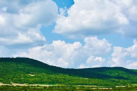 Hills under the Cloudy Sky Stock Photos