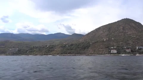 Hills view from the sea to the coast Stock Footage 168886161