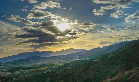 Hillside, clouds, light travel Stock Photos