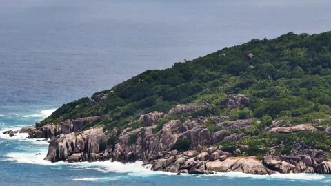 Hillside coastline with rugged rock formations. Seychelles, Mahe. Stock Footage 311141937