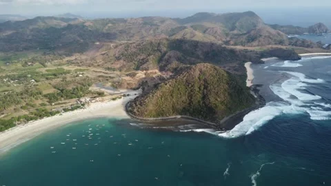 Hillside Majesty: Panoramic Drone View of Coastal Hill in Lombok, Indonesia Stock Footage 259559582