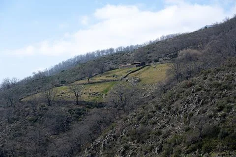 Hillside with Sparse Trees and Small Building from the Ruta Trabuquete, Spain Stock Photos