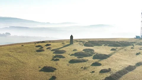 A hillside with a tower in the middle of it Video stock 303987397