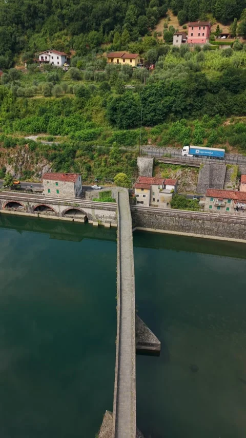 Hillside Village Above Devil's Bridge Causeway and Serchio River, Drone Flyover Stock-Footage 345780370