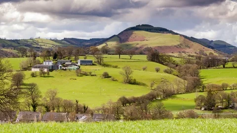 Hilly Green Pastures of Snowdonia in North Wales, UK Stock Footage