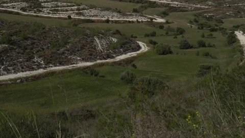 Hilly valley with working wind turbines. Vertical panning Stock Footage 76988805