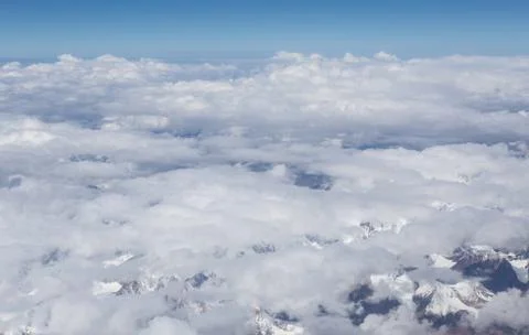 Himalaya mountains under clouds Stock Photos