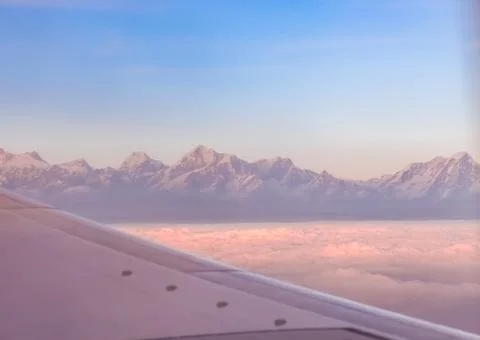 Himalayan mountain range during dusk seen from flight. Stock Photos