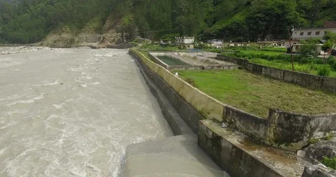 Himalayan river flowing through Himalayan Town Stock Footage 128464827
