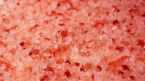 Himalyan pink salt rotating pattern macro texture background backdrop footage Stock Footage 91380234