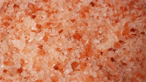 Himalyan pink salt rotating pattern macro texture background backdrop footage Stock Footage 91380467