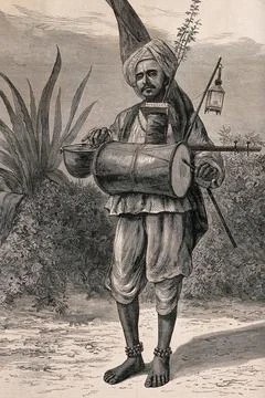 A Hindu ascetic, or holy man: standing, beating a drum with his left hand a.. Stock Illustration