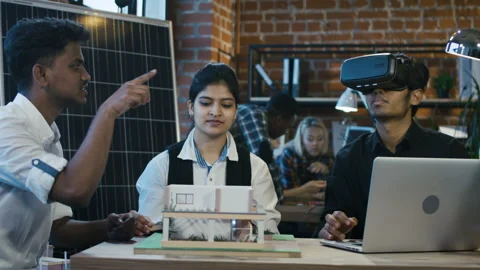 Hindu colleagues developing accommodation with VR Video stock 90403850