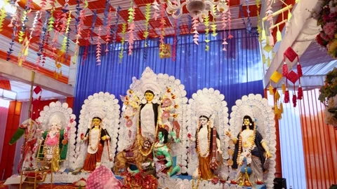 Hindu devotee folding hands before durga idol at dussehra festival in day Stock Footage 314781878