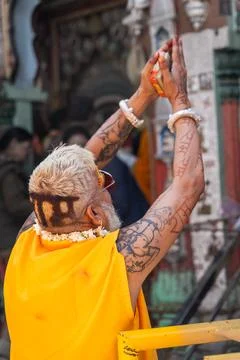 Hindu devotee with lord ram name haircut offering prayers at historic templ.. 写真素材