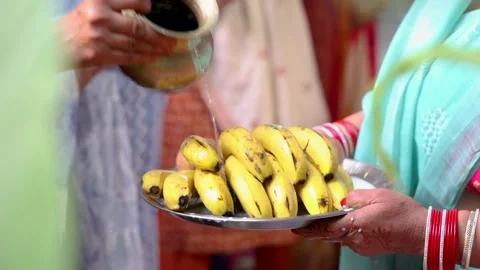Hindu devotee performing chhath puja argha ritual with holy offerings 스톡 동영상 316675536
