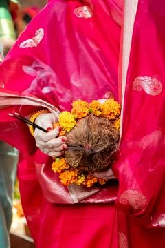 Hindu devotee performing chhath puja with sacred offerings outdoors Stock Photos